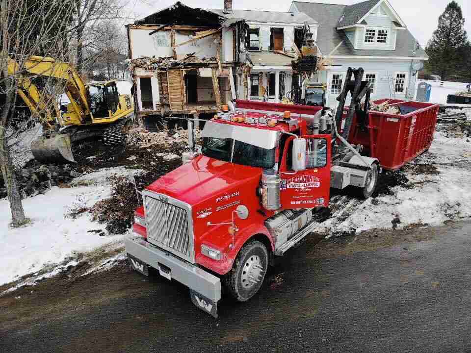 House Demolition with Pleasant View truck - dumpster rentals for demolition sites. Renting a dumpster in the winter.
